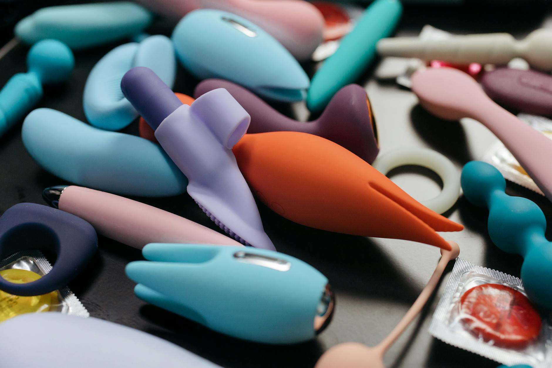 An array of vibrant lemon clitoral vibrators and adult toys in a close-up view