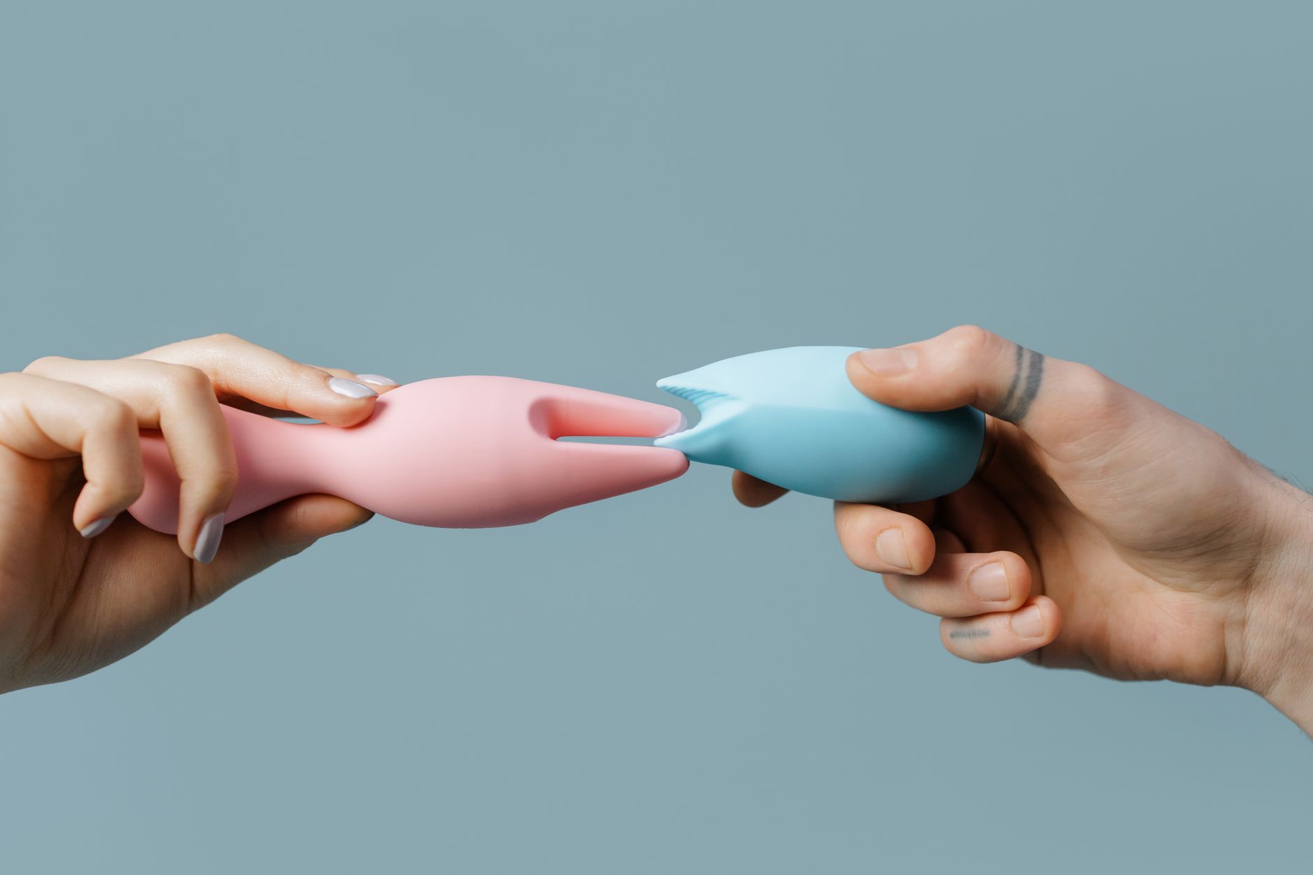 Woman holding a vibrator, considering her pleasure after birth control changes
