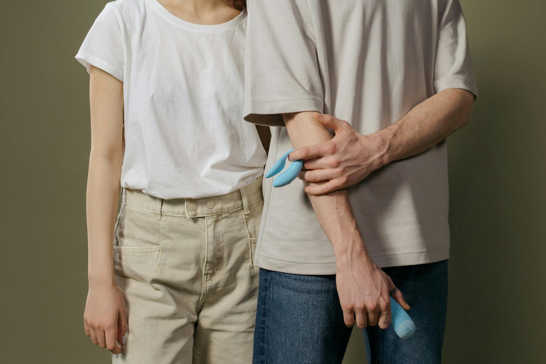 A young couple exploring modern intimacy together with a clitoral vibrator