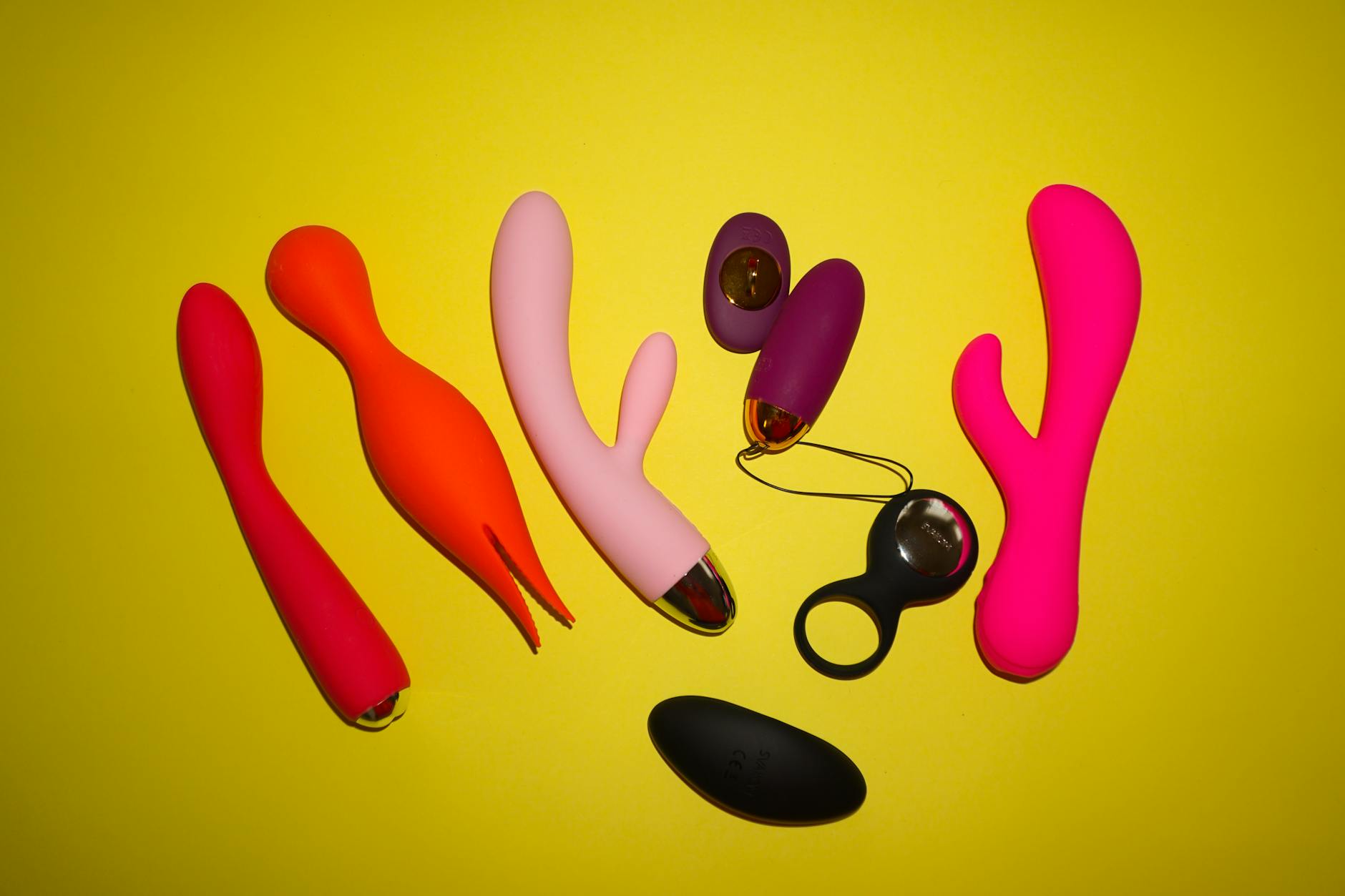 A blue silicone vibrator held against a purple background, representing clitoral stimulation and restored sensation